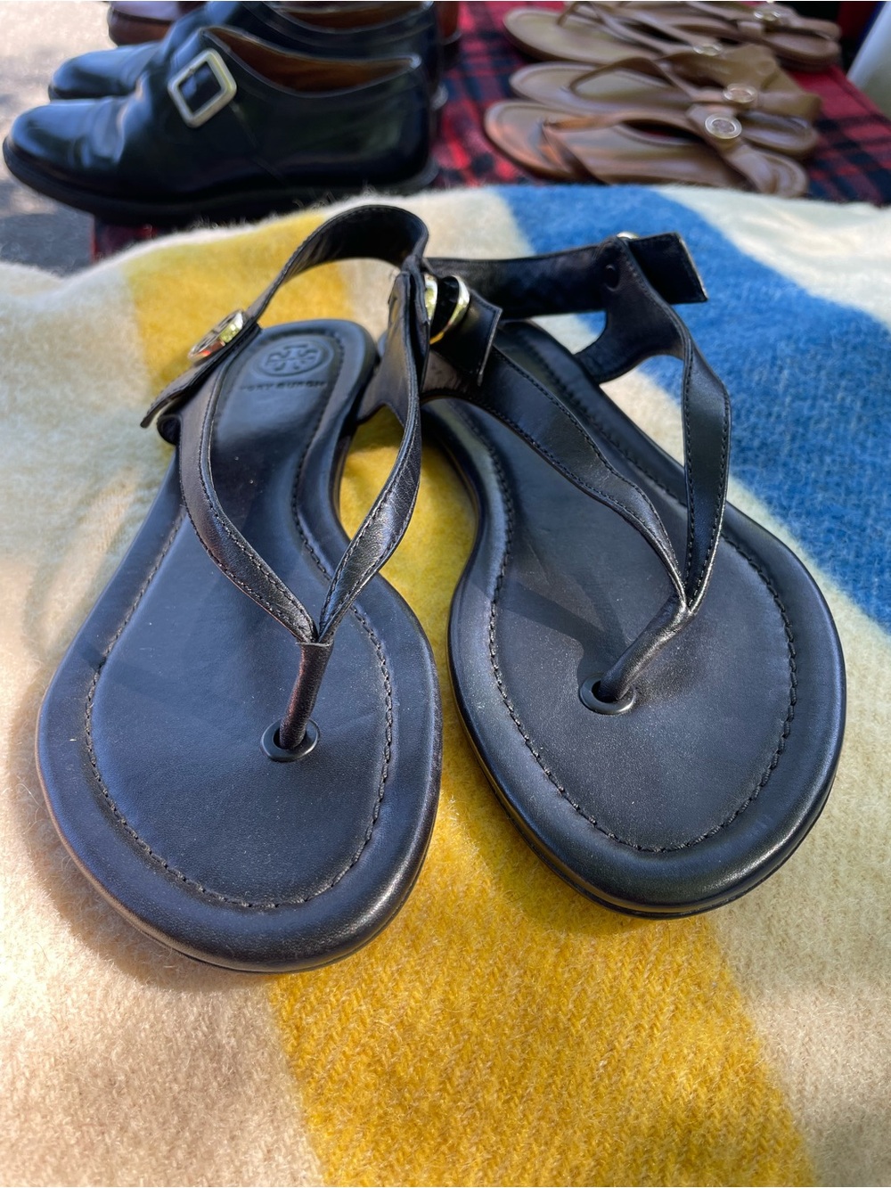 Tory Burch Black Leather T-Strap Sandals with Gold Logo Accent
